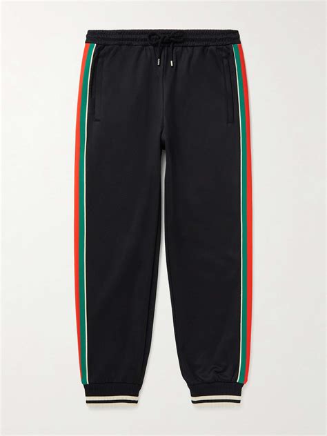 pantaloni gucci uomo con scritta|Nuova collezione di pantaloni da uomo di Gucci su FARFETCH.